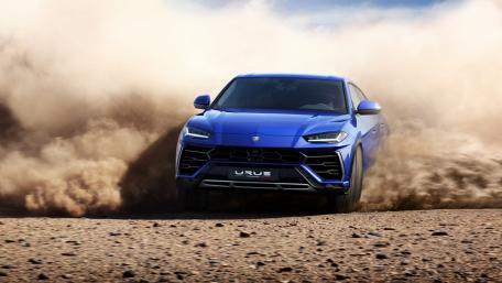 Dynamic Blue Lamborghini Urus in Action wallpaper