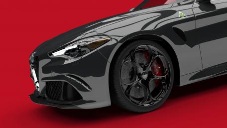 Sleek Black Sports Car on Bold Red Background wallpaper