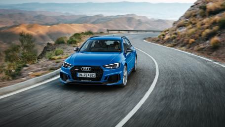 Sleek Audi Performance on Mountain Roads wallpaper