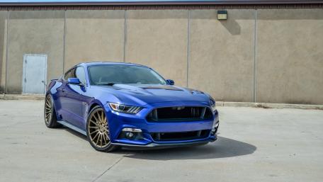 Sleek Blue Sports Car Wallpaper wallpaper