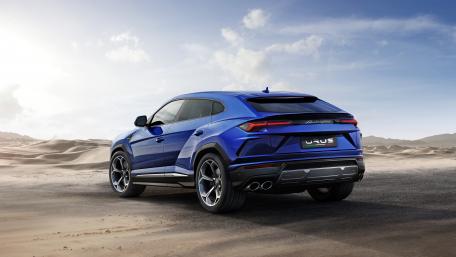 Sleek Blue SUV in a Desert Landscape wallpaper