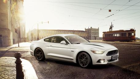 Sleek White Mustang on a Sunlit Street wallpaper