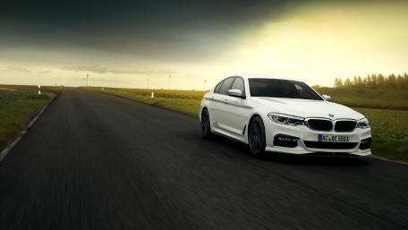 Sleek White BMW on Open Road wallpaper