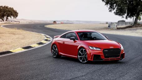 Sleek Red Audi TT Racing on Scenic Track wallpaper