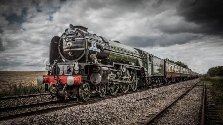 Majestic Steam Train on the Rails wallpaper
