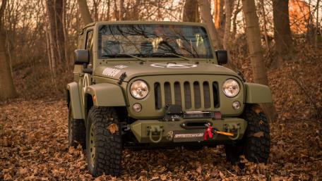 Stealthy Military Jeep in Nature wallpaper