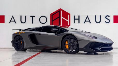 Sleek Lamborghini Aventador in Modern Showroom Setting wallpaper