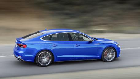 Sleek Blue Sports Car on the Move wallpaper