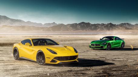 Dynamic Duo of Luxury Sports Cars in Scenic Desert wallpaper