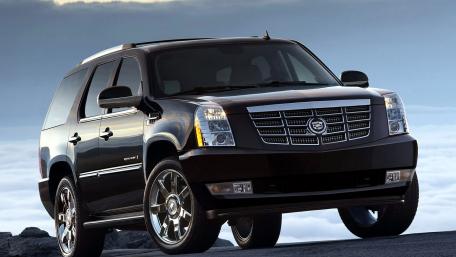 Sleek Black SUV on a Mountainous Landscape wallpaper