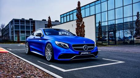 Sleek Blue Mercedes Coupe on Display wallpaper