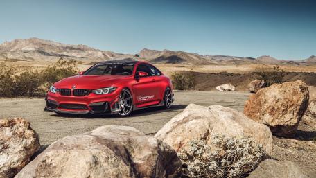 Sleek Red BMW on a Scenic Desert Road wallpaper