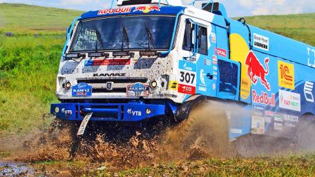 Rally Truck Splashing Through Muddy Terrain wallpaper