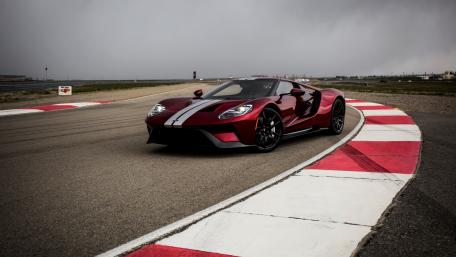 Sleek Red Sports Car on the Track wallpaper