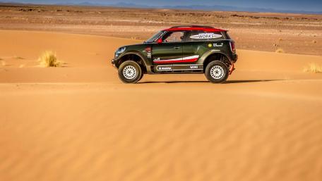 Dynamic Mini Racing in the Desert Landscape wallpaper