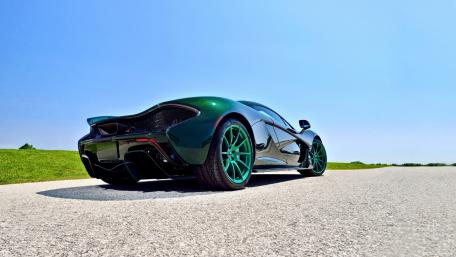 Sleek Green McLaren P1 on a Sunny Road wallpaper