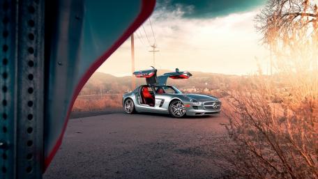 Sleek Silver Sports Car in Nature's Embrace wallpaper