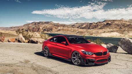 Sleek Red BMW on Scenic Landscape wallpaper