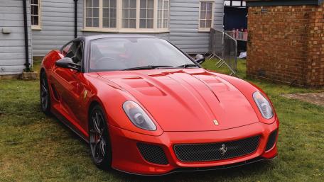 Sleek Red Ferrari in a Scenic Setting wallpaper