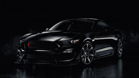 Sleek Black Mustang in Dramatic Lighting wallpaper