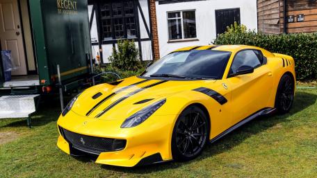 Vibrant Yellow Sports Car on Display in Nature wallpaper
