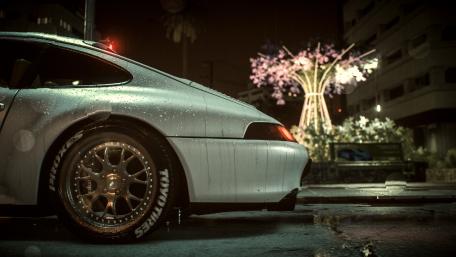 Sleek Sports Car in Urban Night Rainy Scene wallpaper