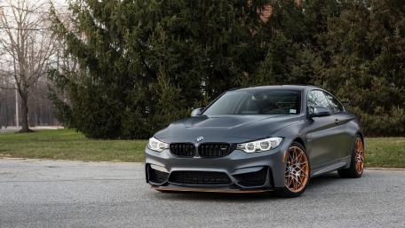 Sleek BMW M4 Coupe in Urban Setting wallpaper