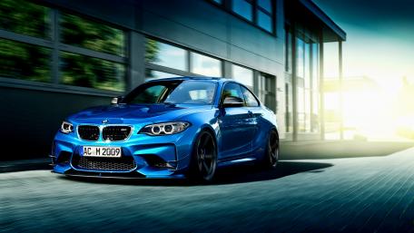 Sleek Blue BMW Racing Ahead in Style wallpaper
