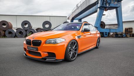Bold BMW M5 in Striking Orange Finish wallpaper