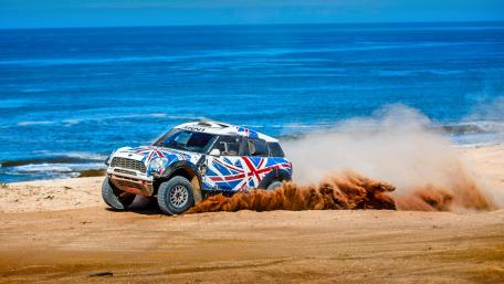 Rally Racing Against Ocean Backdrop wallpaper