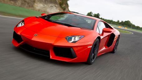 Sleek and Powerful Red Sports Car Wallpaper wallpaper