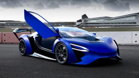 Sleek Blue Hypercar with Dramatic Doors Opened wallpaper
