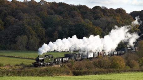 Steam Engine Journey Through Scenic Landscape wallpaper
