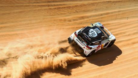 Rally Car Triumph on Sandy Terrain wallpaper