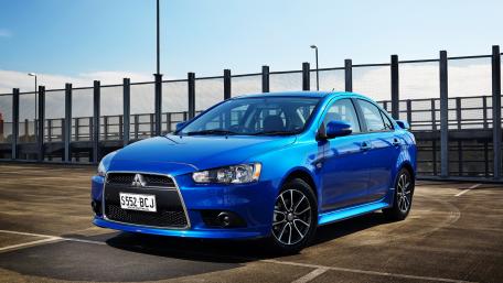 Sleek Blue Car in Urban Setting wallpaper