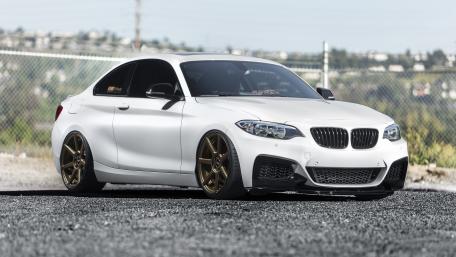Sleek White BMW with Bronze Wheels Showcase wallpaper