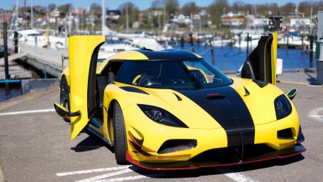Stunning Yellow Supercar at the Dock wallpaper