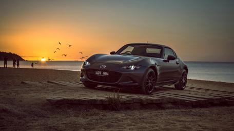 Sunset Drive with a Stylish Car wallpaper
