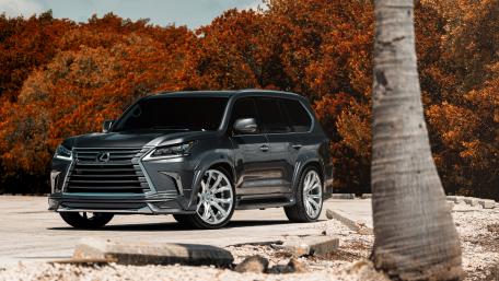 Sleek Luxury SUV in Vibrant Autumn Scenery wallpaper
