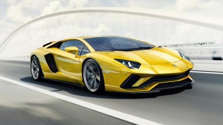 Sleek Yellow Lamborghini on the Open Road wallpaper