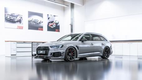 Sleek Audi RS4 Avant in Modern Workshop Setting wallpaper