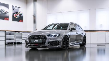 Sleek and Powerful Audi ABT in Modern Garage Setting wallpaper