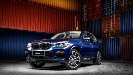 Sleek BMW X3 in Industrial Setting wallpaper