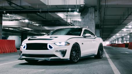 Sleek White Sports Car in Urban Setting wallpaper