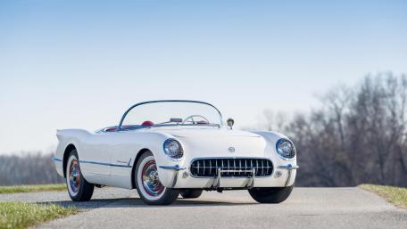 Classic Convertible in a Scenic Landscape wallpaper