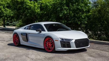 Sleek Silver Sports Car with Bold Red Wheels wallpaper