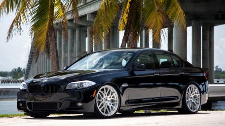 Sleek Black BMW by the Water wallpaper