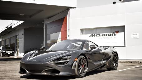 Sleek McLaren 720S in Stunning Showroom Setting wallpaper