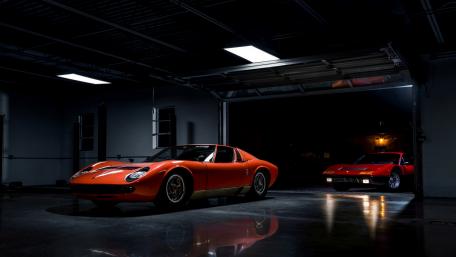 Classic Cars in Dramatic Lighting Showcase wallpaper