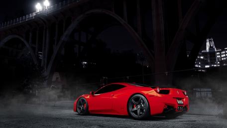 Sleek Red Supercar Under Urban Night Lights wallpaper